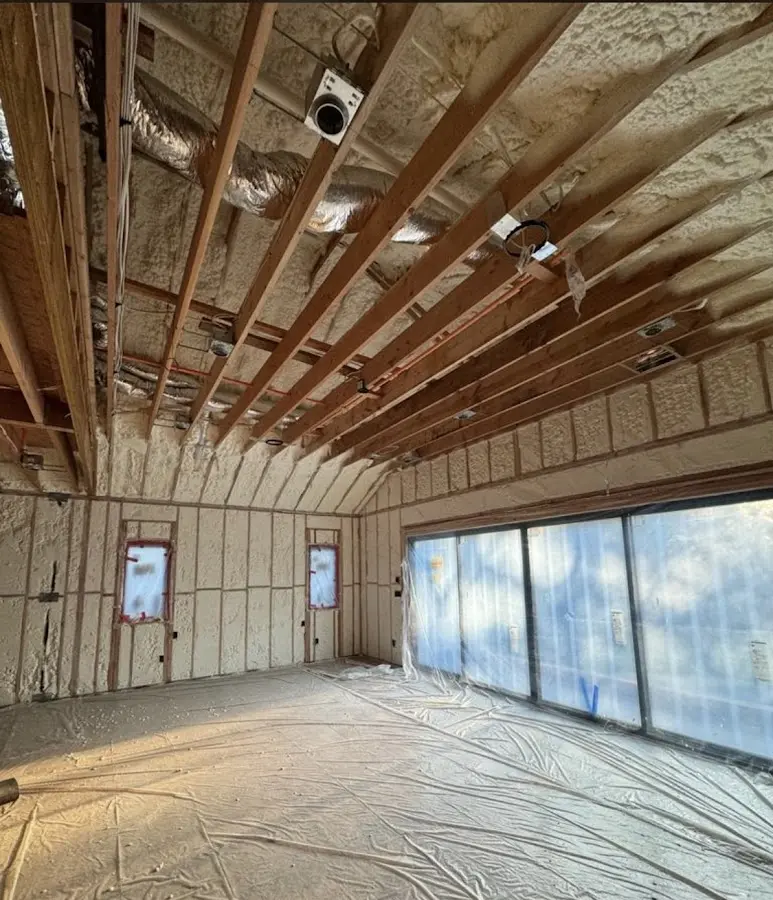 Interior walls and ceiling insulated with spray foam during new construction in Lauderdale Lakes